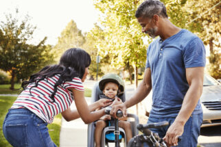 Getting your child ready to use a rear bike seat - strapping them in