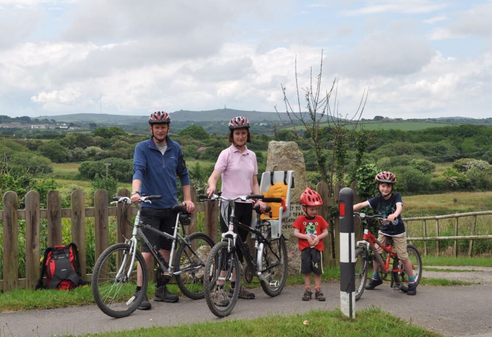 Karen Gee and Chris Jones with their two kids on holiday cycling.