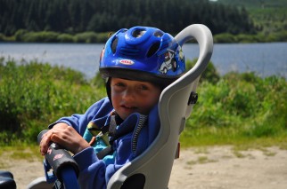 rear mounted child's bike seat fixed to the back of an adult bike