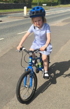 6 year old girl Squish Bike cycling to school
