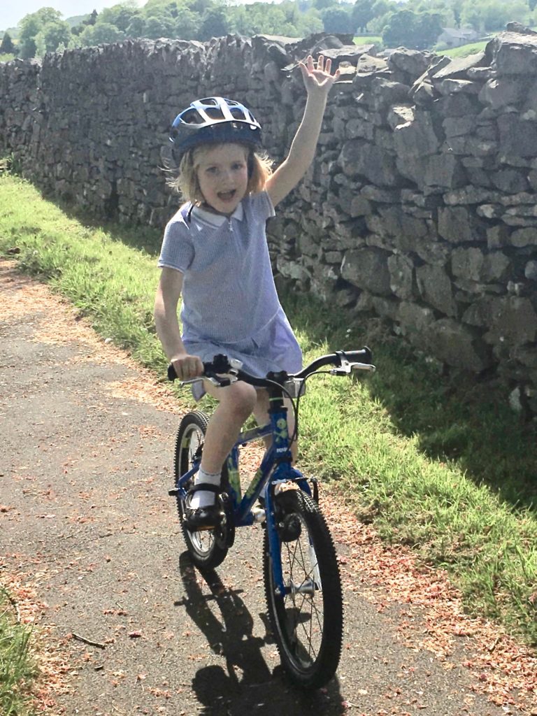 Katherine on Squish Bike hand in air