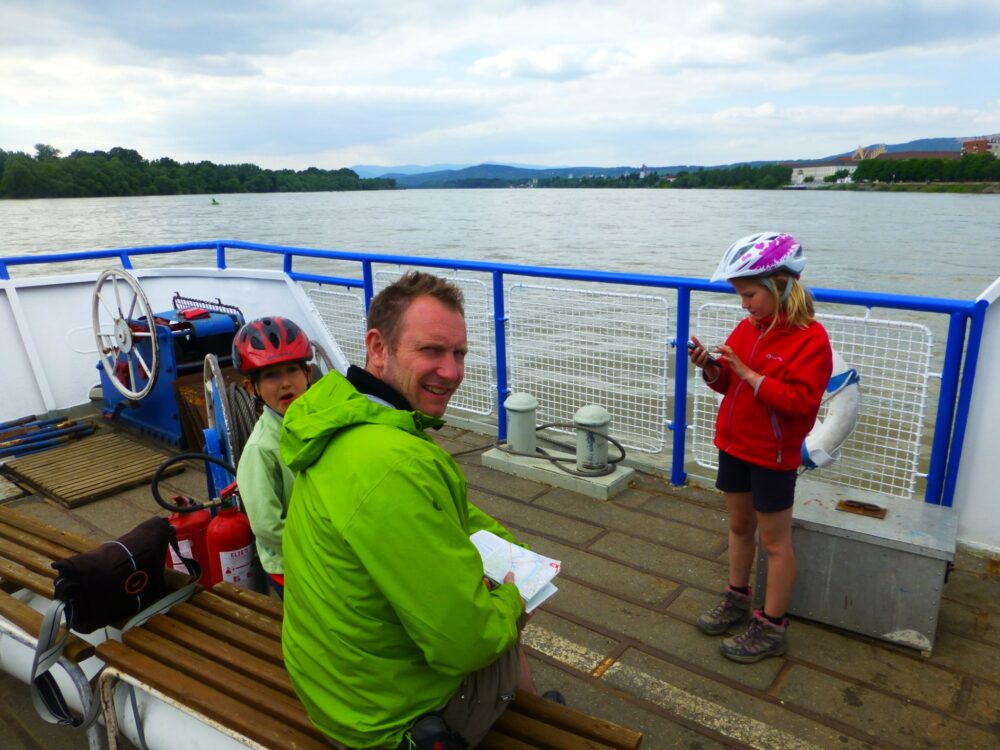 Taking the boat along the River Danube with bikes and kids on our Family cycling holiday along the River Danube from Vienna to Budapest