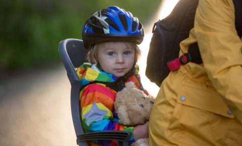 Boy in rear bike seat