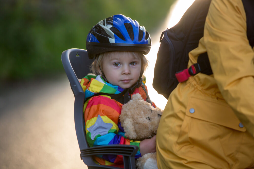 Boy in rear bike seat