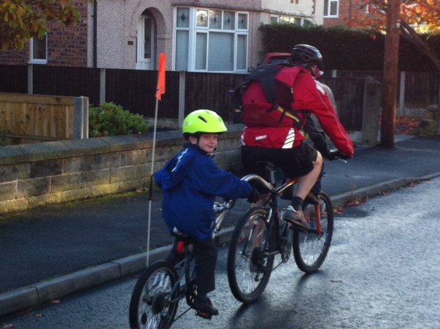 Review of the bright yellow Proviz Eris high visibility kids cycle helmet with light on the back of the helmet