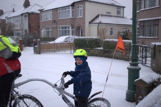 Setting off on the bike ride to school in the snow