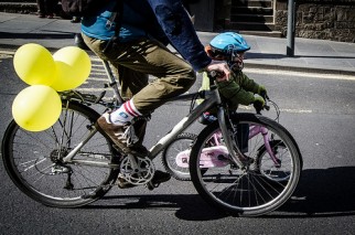 Young child riding bike during Pedal on Parliament