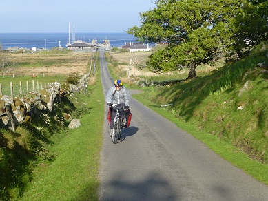 Granny riding her bike on a Scottish Islands family cycling holiday