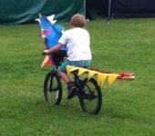 Kids bike decorated as a dragon at the Hebden Bridge Handmade Parade