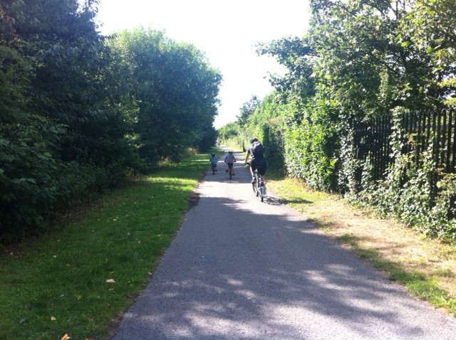 My 3 boys riding their bikes away from me