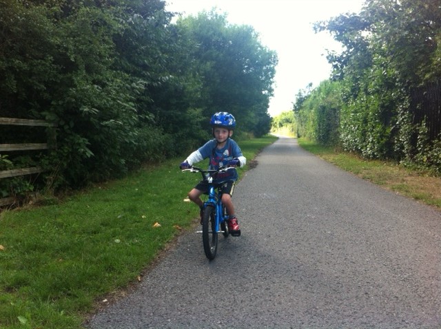 T riding his Islabike Cnoc 16 on his first family bike ride