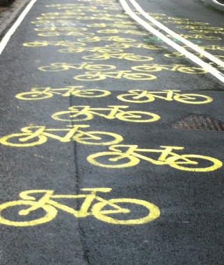 Yellow bikes painted on road during Tour de France