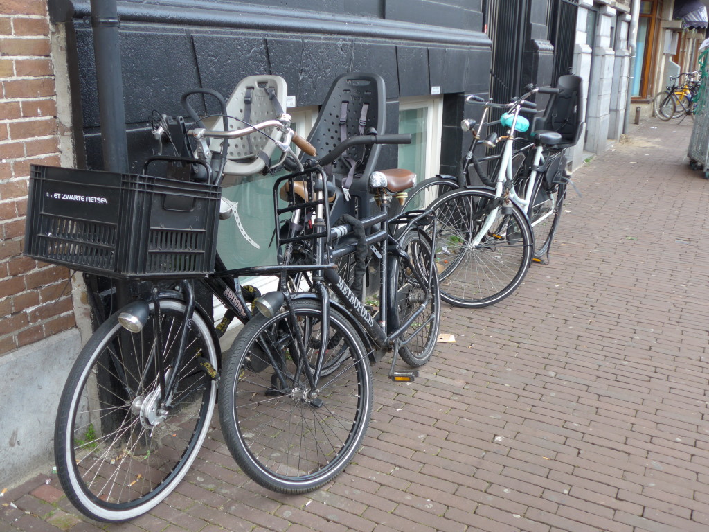 Photo of Dutch bikes with front and back kids bike seats - Amsterdam, Holland