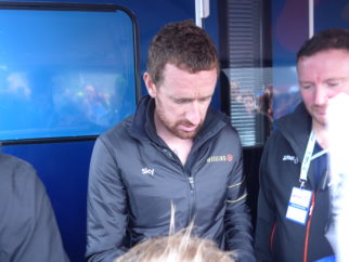 Bradely Wiggins signing an autograph for a young fan - stage 2 of Tour of Britain 2016
