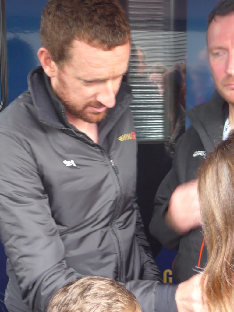 Bradley Wiggins signing school jumper 