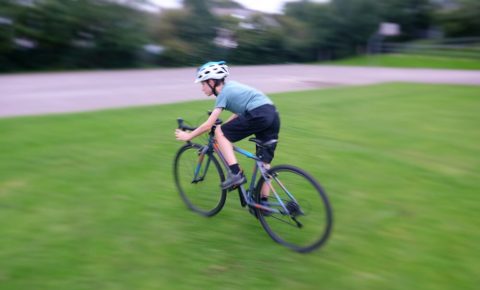 Cuda CP700R kids road / cyclocross bike in action shot of cyclocross tyres on grass