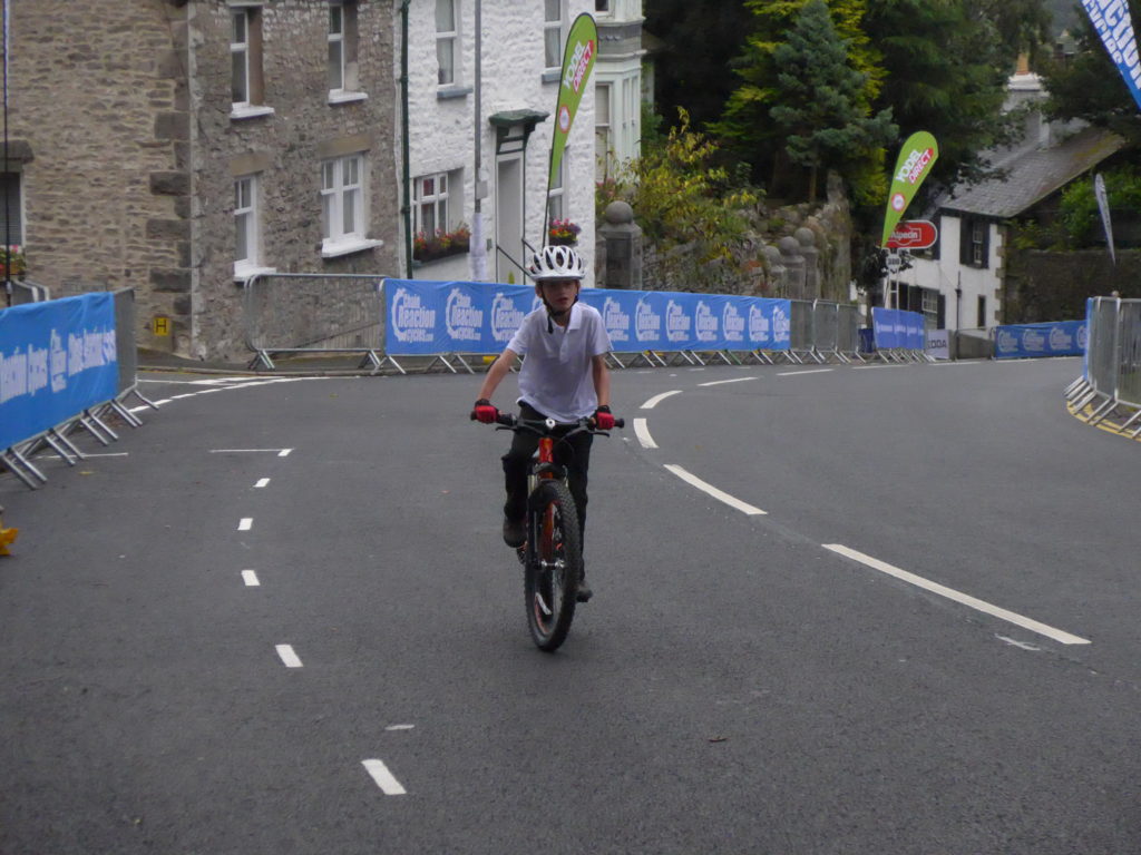 7 year old riding his Islabike up Beast Banks Kendal, Tour of Britain 2016 