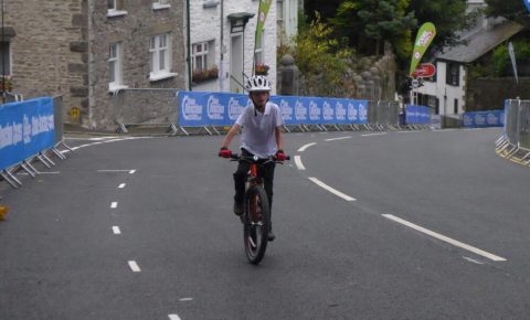 7 year old riding his Islabike up Beast Banks Kendal, Tour of Britain 2016