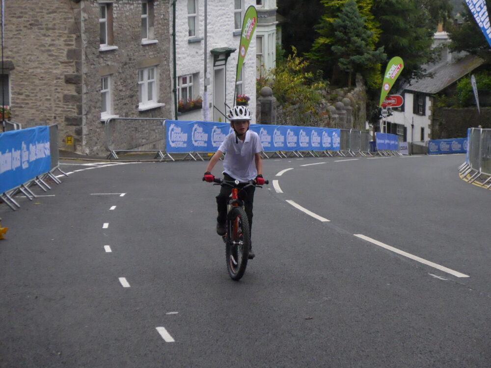 7 year old riding his Islabike up Beast Banks Kendal, Tour of Britain 2016