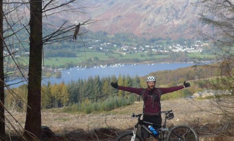 Mountain biking during the autumn at Grizedale Forest, Cumbria
