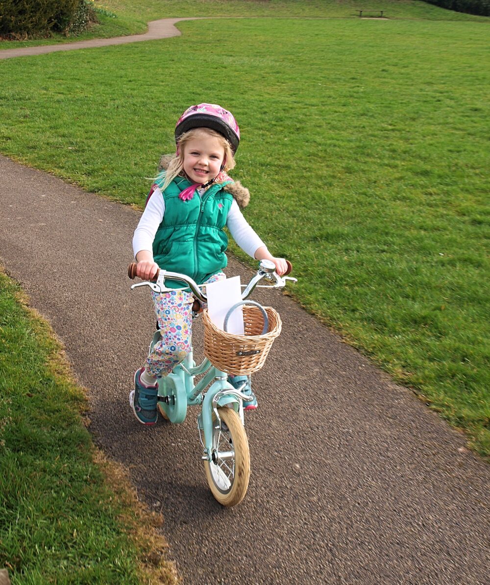 best bike for my child - little girl on first pedal bike