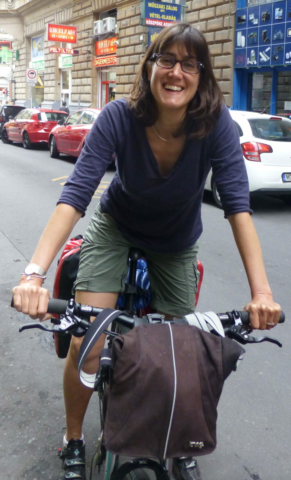 Kathryn astride bike Budapest Kathryn Yates on a bike