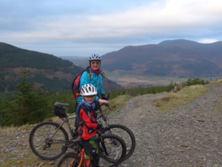 Family cycling during the winter at Whinlater Forest, Cumbria