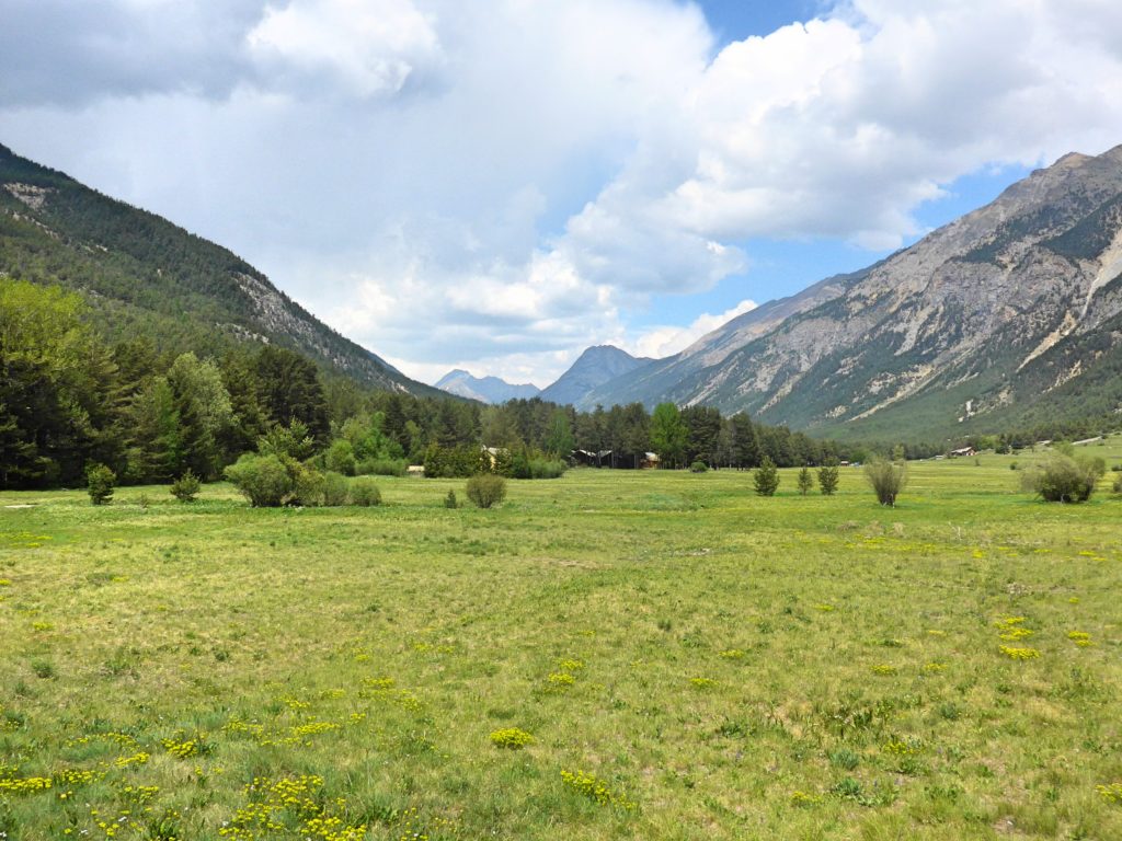 Family cycling in the Vallée de la Clarée in the French Alps - a beautiful valley