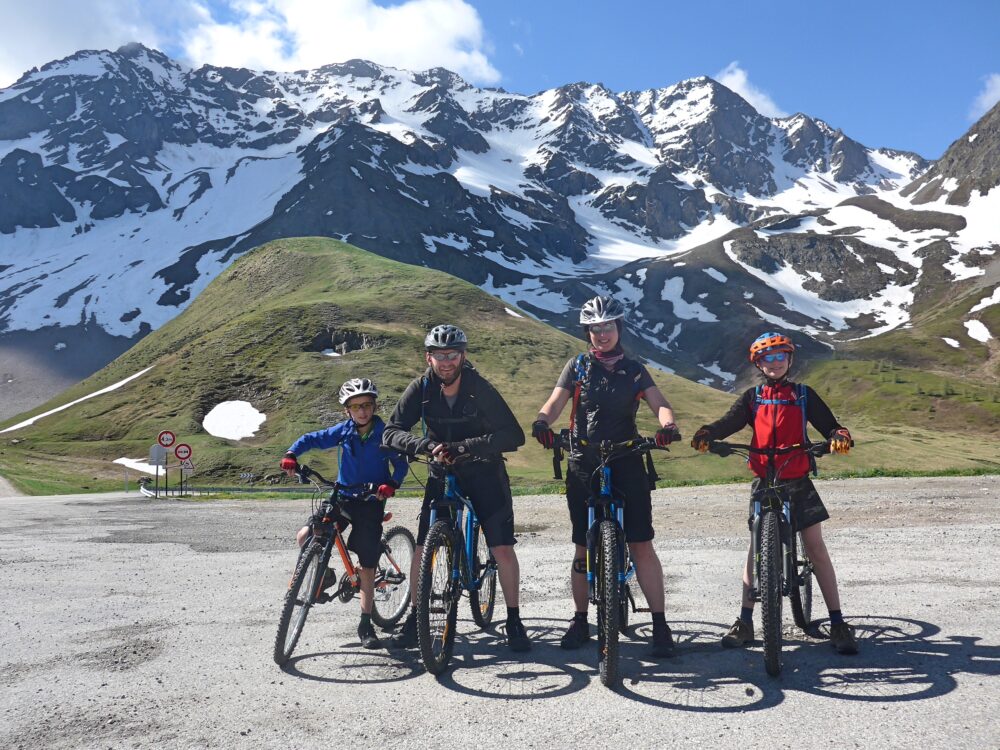 Family Cycling from the top of the Col du Lautaret, French Alps