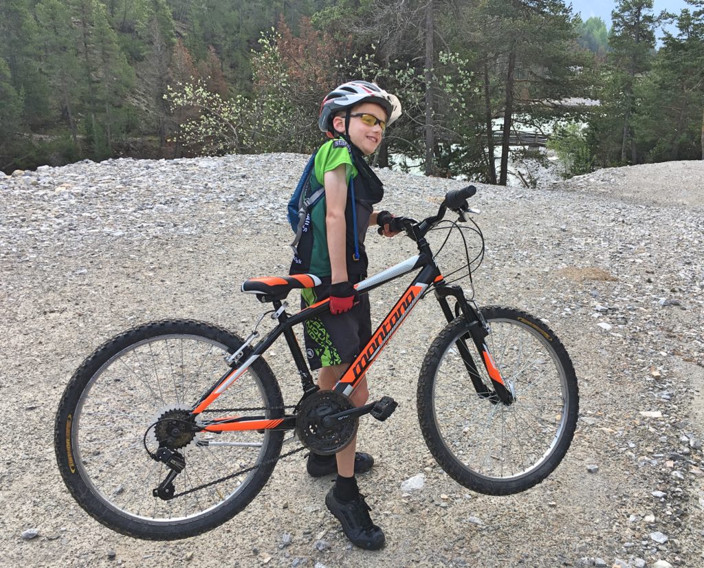 Family cycling in the Vallée de la Clarée in the French Alps - our 8 year old strugged to lift his heavy bike