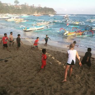 Playing with the locals on family cycling holiday Bali Indonesia