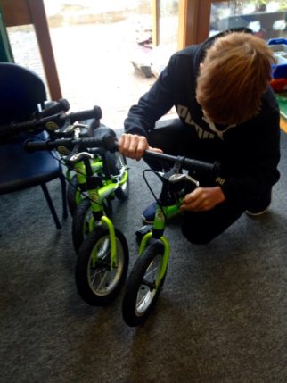 Doing M-Checks on balance bikes during the teachers course on how to teach kids to balance bike in school lessons
