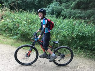 Big smiles from our reviewer of the Frog MTB 69 kids 26 inch wheel mountain bike