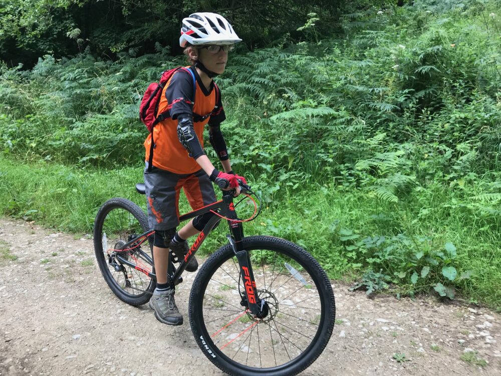 Best 26" kids' bikes: a boy on a mountain bike in a gravel path