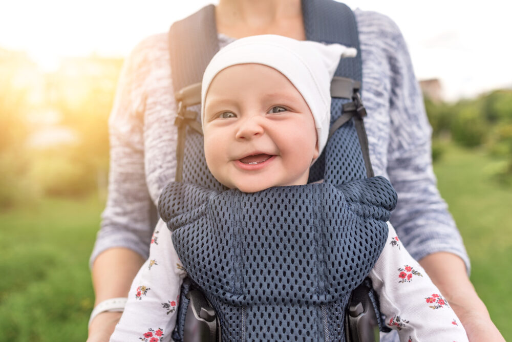 Is it safe to cycle with my baby in a sling or papoose?