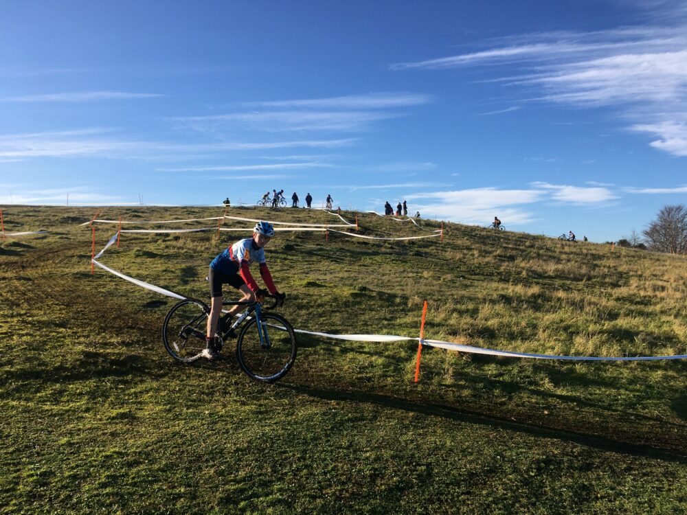 Riding in a junior British Cycling cyclocross U14's kids cycle race (CX)