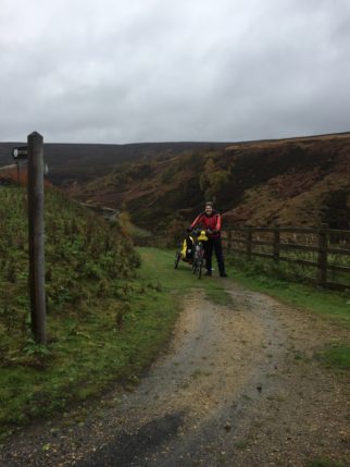 Cycling the Trans Pennine Trail at Woodhead with children in a trailer and on bikes