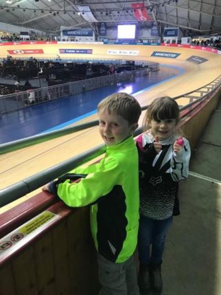 Kids watching track cycling at the velodrome