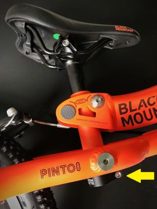 Adjusting the saddle on the Black Mountain Pinto balance bike