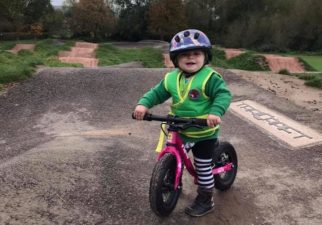 Girl on Balance Bike at Pump Track