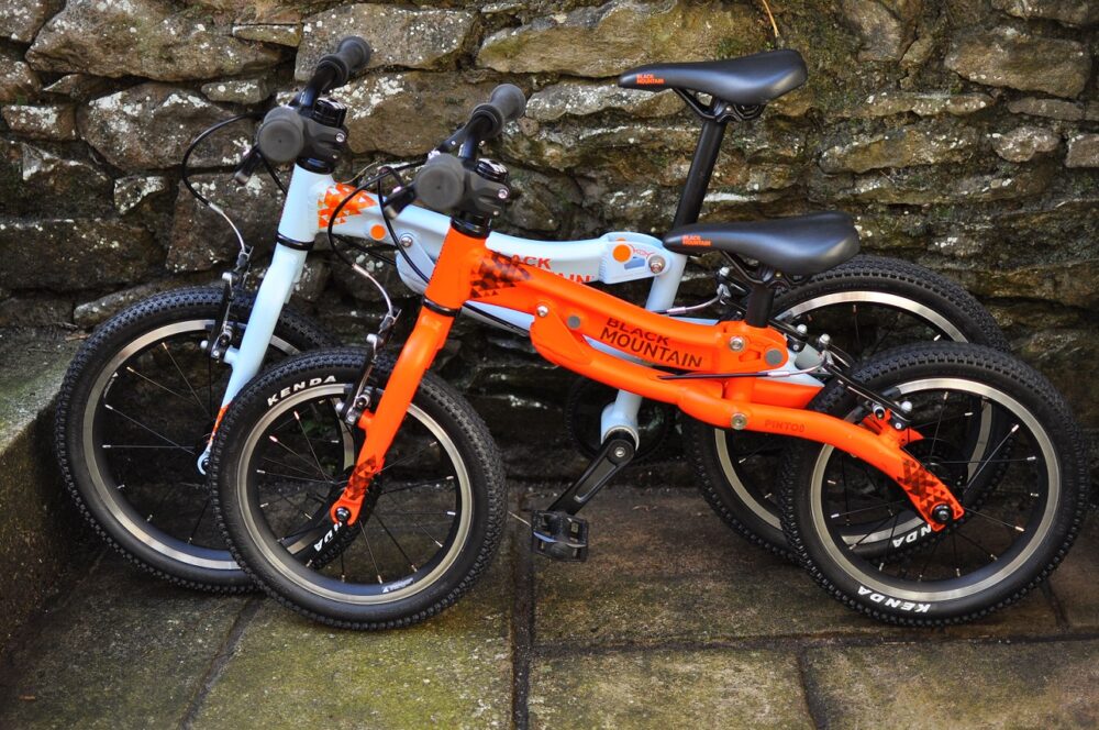 Black Mountain Pinto and Skog Bike Review - the two kids bikes next to each other showing the size difference