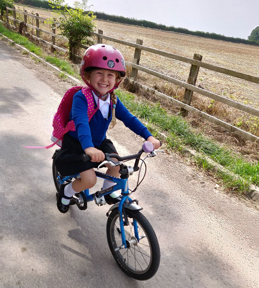 Girl cycling to school