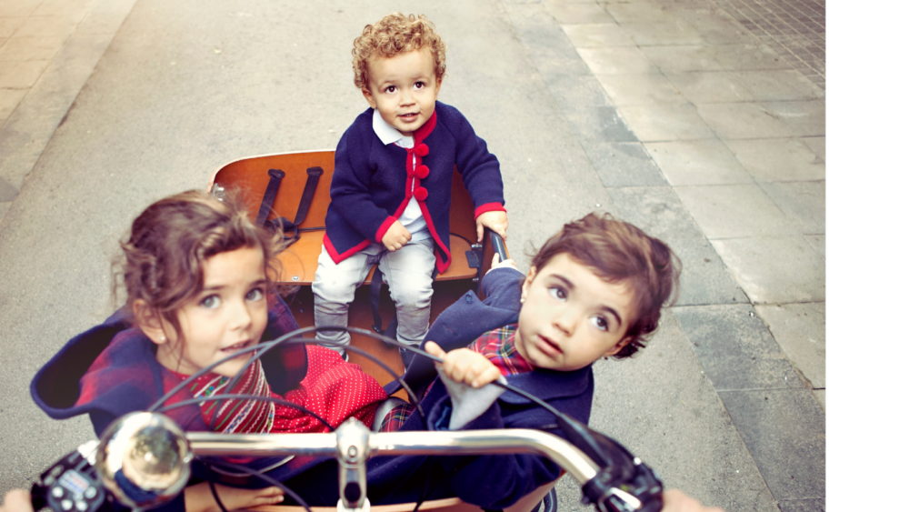 Best cargo bike for your family - three children in cargo bike