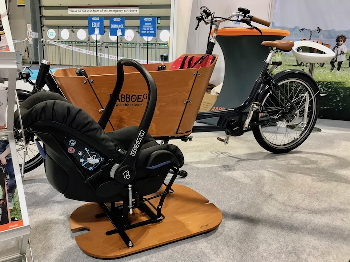 family cargo bikes at the 2019 Cycle Show - Babboe City with Maxi Cosi baby seat carrier shown alongside