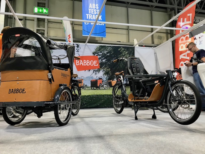 family cargo bikes at the 2019 Cycle Show - Babboe Curve shown on the left