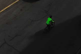 Unsplash - Sebastian Huxley - cyclist riding on pavement by themselves