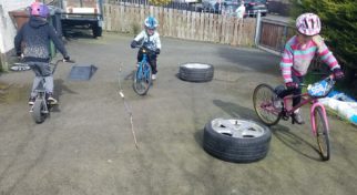 Kids riding their bike on the driveway