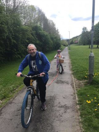 Using a tow rope to tow your child behind your bike is good on the flat or going up hill, but you must remember to unhook it when you go downhill 