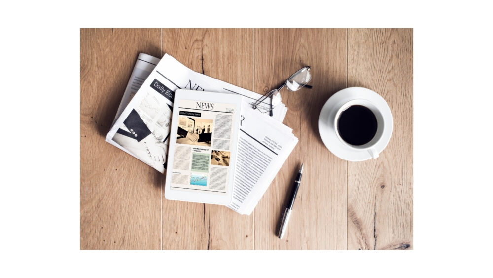 Family Cycling News - newspaper and coffee cup on table