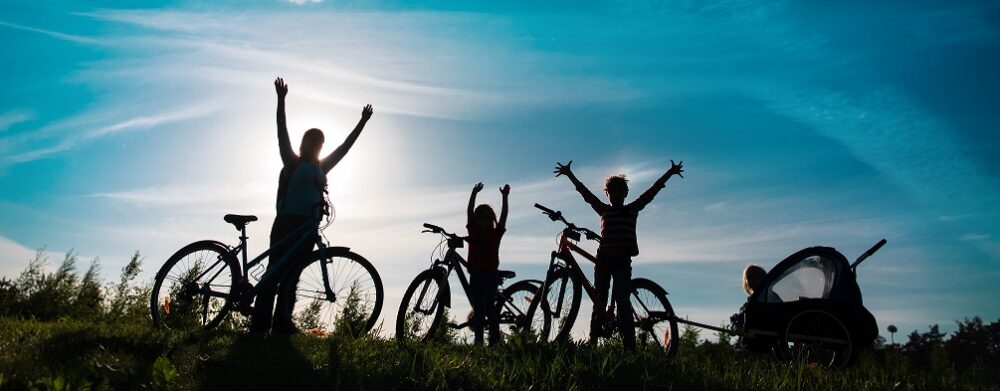 Silhouette of family cycling